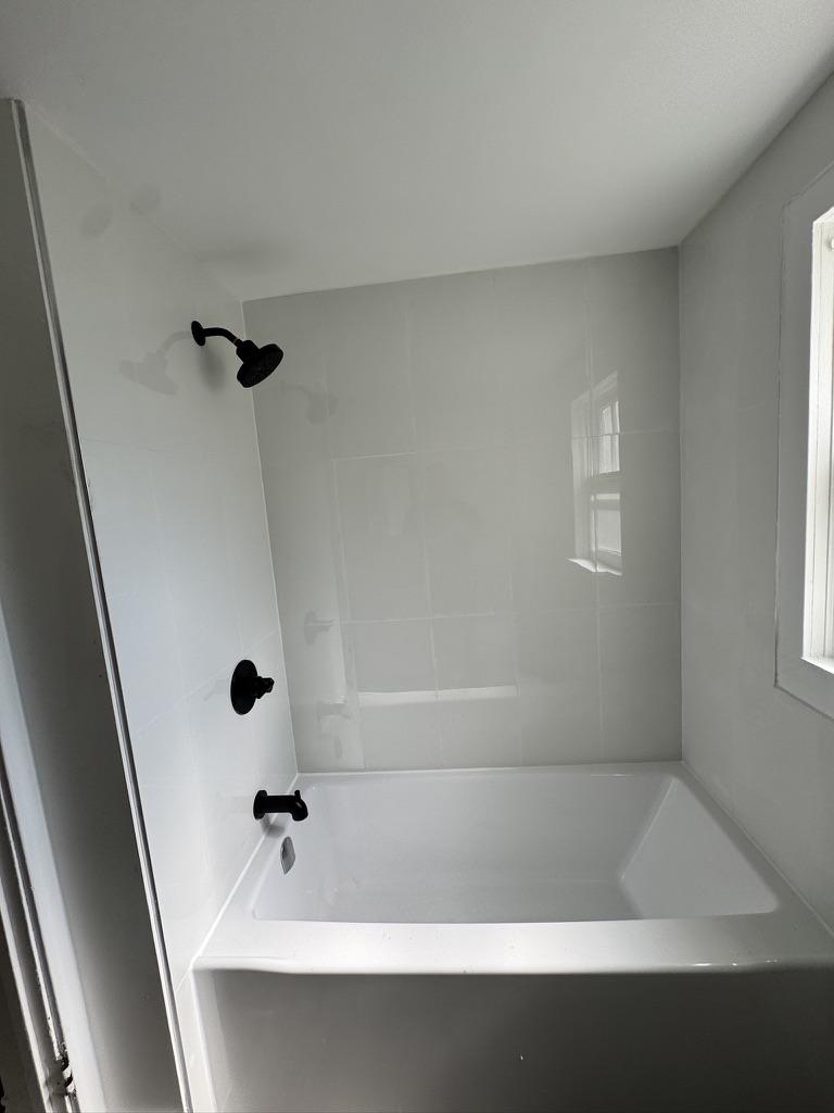 Barthe St, Chatham — bathroom after renovation with new tub and surround